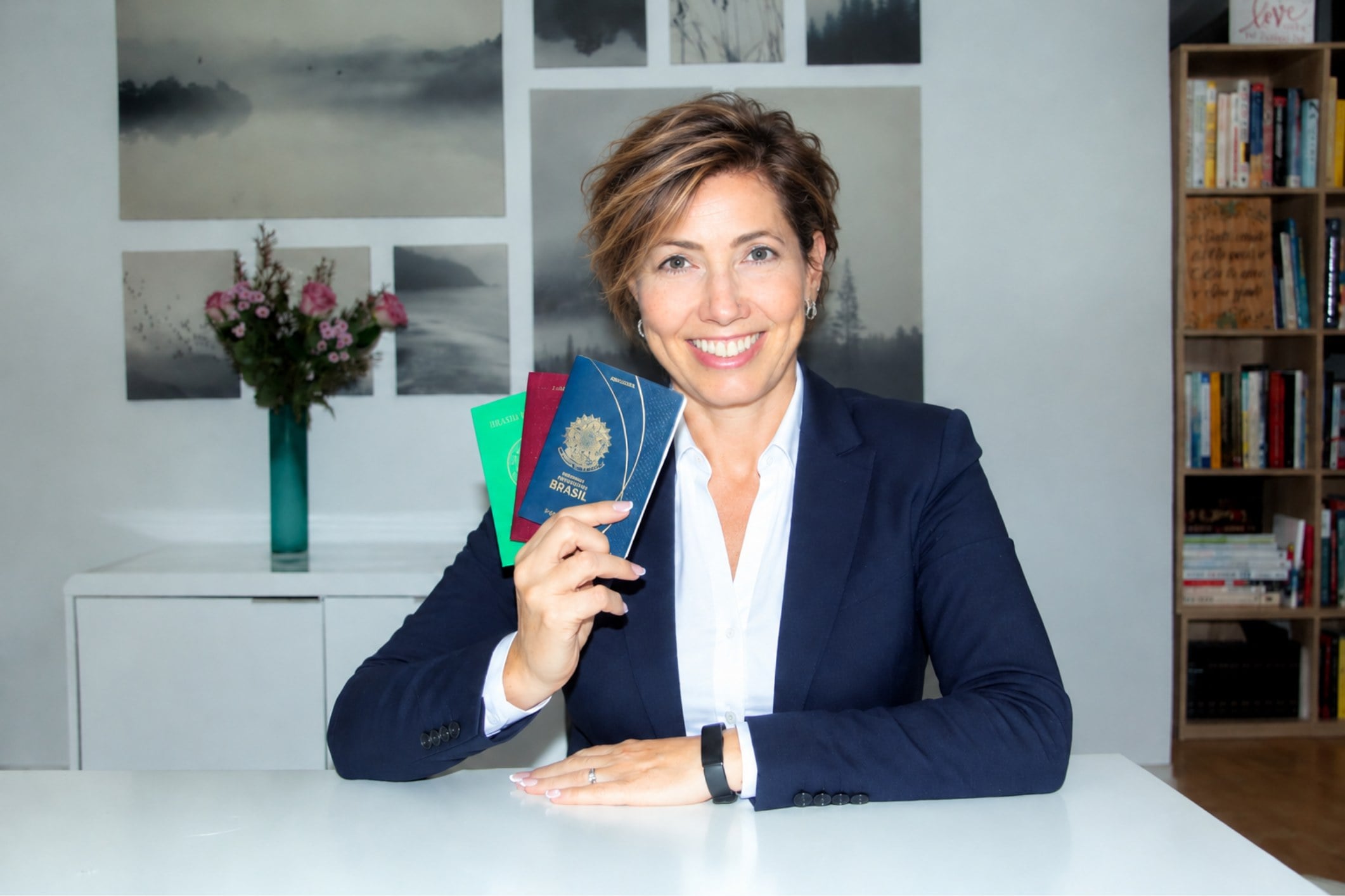 Betina Meyer Pflug, coach, holding passports in her office